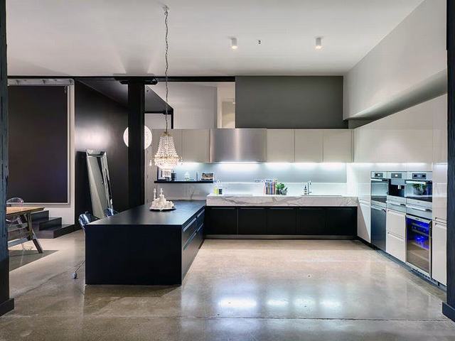 Black-Kitchen-Countertop-with-Polished-Concrete-Floors